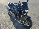 a motorcycle that is parked on the side of the road