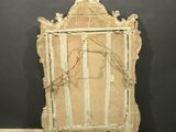 an old wooden frame with a picture of a bird on it