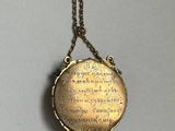 an image of a necklace with a quote on it hanging from a chain