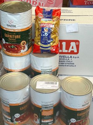 several cans of food are stacked on top of each other