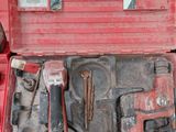 a red tool case with tools in it on a table