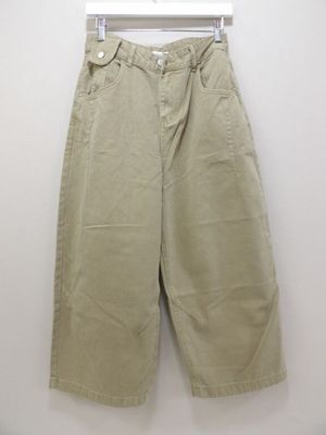 an image of a pair of khaki pants hanging on a hanger