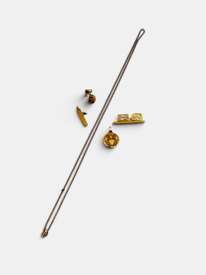 a close up of a needle and some other items on a white surface