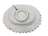 a white plate with a chain hanging from it
