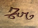 an image of a close up of a piece of wood with the word love written on it