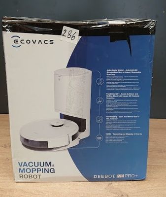 La boîte du robot aspirateur-laveur est ouverte sur la table.