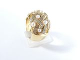 an image of a diamond and pearl ring on a white surface