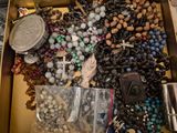 a box full of assorted beads and other items