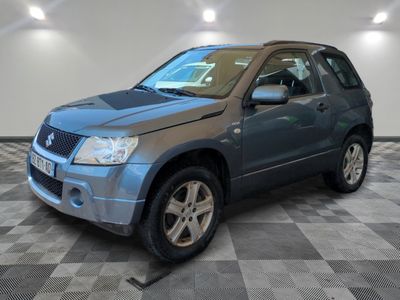 a picture of a blue suv parked in a garage