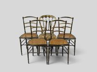 Suite de 4 chaises à bandeaux, assise à fond de canne en boi…