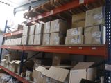 many boxes on the shelves in the warehouse