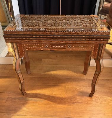 a small table with a drawer on top of it