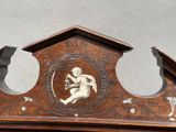 a wooden clock with a picture of a man on it