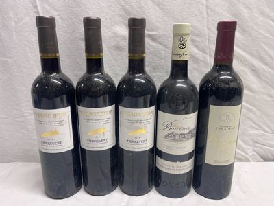 six bottles of red wine are lined up on a table