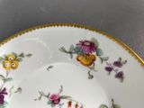 a close up of a plate with flowers on it