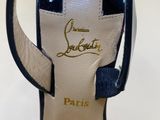 a close up of a pair of blue and white high heeled shoes
