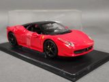 a red model of a ferrari sports car on a black base
