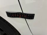a close up of a sticker on the side of a white car