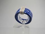 an image of a blue ring with two diamonds on it
