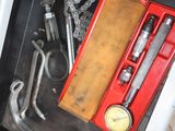 a box with tools inside of it on the floor