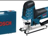 une raboteuse Bosch avec une boîte à outils et une mallette à outils