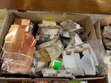 a cardboard box full of assorted items on a table