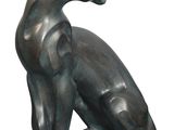 statue of a cat sitting on its hind legs on a white background