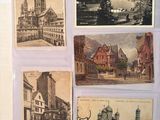 several old postcards of different buildings and buildings on a table