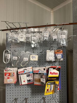 a picture of a pegboard with many items hanging on it