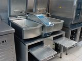 many sinks in a public restroom with a lot of sinks