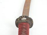 a close up of a knife on a white surface