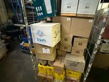 many boxes stacked on a cart in a warehouse