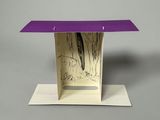 a purple table with a bird on top of it