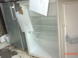 a refrigerator that has a lot of papers on the door