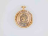 a picture of a gold pocket watch with a picture on it