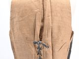 the back view of a mannequin torso with a brown vest and black laces