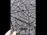 a person holding a black and white picture of a map