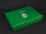 a close up of a green box on a black surface