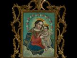 painting of a woman holding a baby in a gold frame