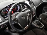 the interior of a car with a steering wheel and dashboard controls