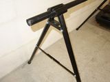 an image of a gun on a tripod in a garage