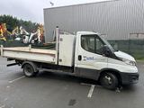 a white truck that is parked in a parking lot