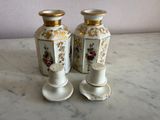 two vases that are sitting on a marble table