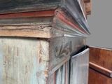 a close up of a piece of wood on the side of a cabinet