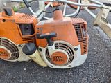 two chains attached to a chainsaw on the ground