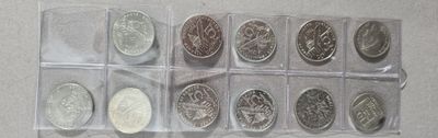 six different types of coins in a clear box