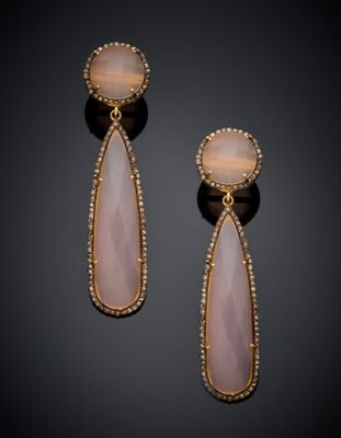 a pair of gold and pink stone earrings