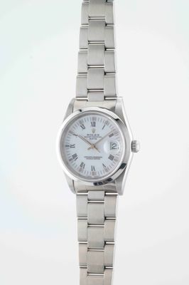 an image of a woman ' s wrist watch with roman numerals