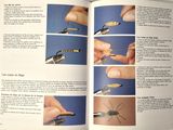 an open book with instructions on how to use scissors