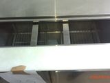 a stainless steel counter top with a grill inside of it